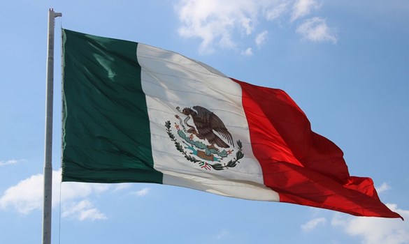 National flag of Mexico against blue sky